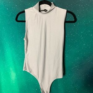 Silver bodysuit with a mock neck